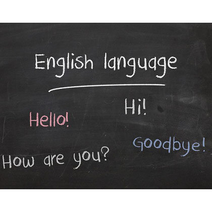 Black chalkboard has words written on it in different colored chalk. "English language" is at the top, underlined. Underneath is "Hello!", 'Hi!", How are you?", and "Goodbye!"