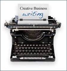 An old-fashioned manual typewriter has a piece of paper that reads, "Creative Business Writing" in its rollers.