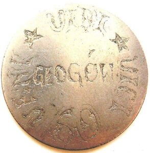 Ancient round gold piece with "Veni Vidi Vici" written on it.