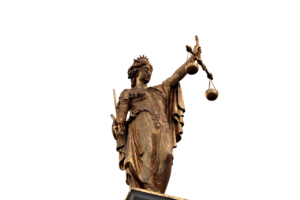 Bronze statue of Justitia holding up scales of justice.