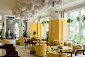 Bright restaurant with yellow chairs and accents