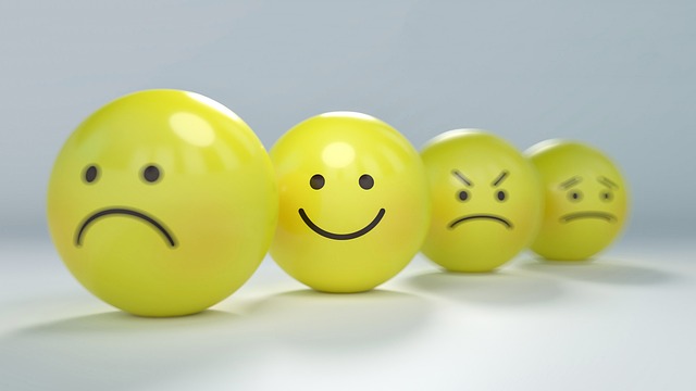 3D yellow emoticons showing sadness, happiness, and anger.