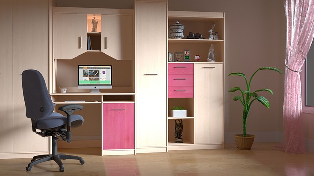 Pink and tan office with bookshelves, drawers, and plants