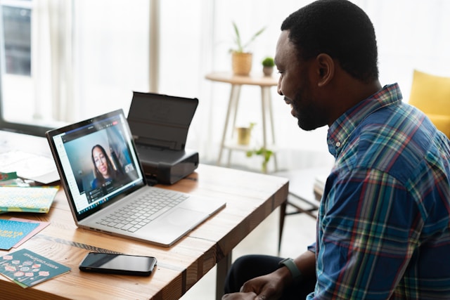 Person having a remote meeting with another individual.