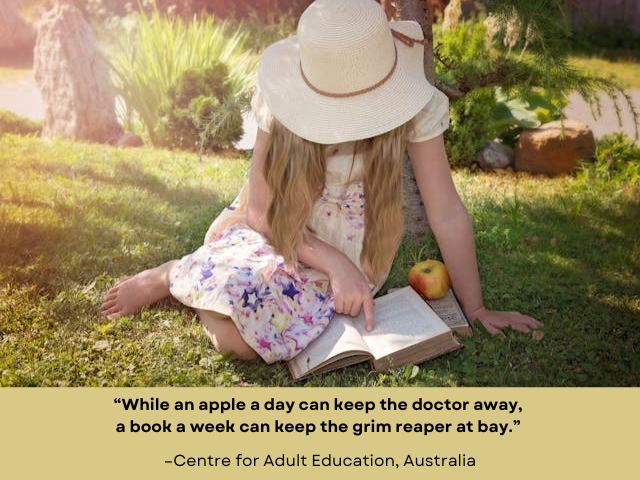 Barefoot person wearing dress and sun hat sitting on the grass, reading and eating an apple. Text reads: "While an apple a day can keep the doctor away, a book can keep the grim reaper at bay. -Centre for Adult Education, Australia."