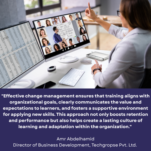 Person raising her hand in a virtual training session. Caption reads: "Effective change management ensures that training aligns with organizational goals, clearly communicates the value and expectations to learners, and fosters a supportive environment for applying new skills. This approach not only boosts retention and performance but also helps create a lasting culture of learning and adaptation within the organization." -Amr Abdelhamid, Director of Business Development, Techgropse Pvt. Ltd. 