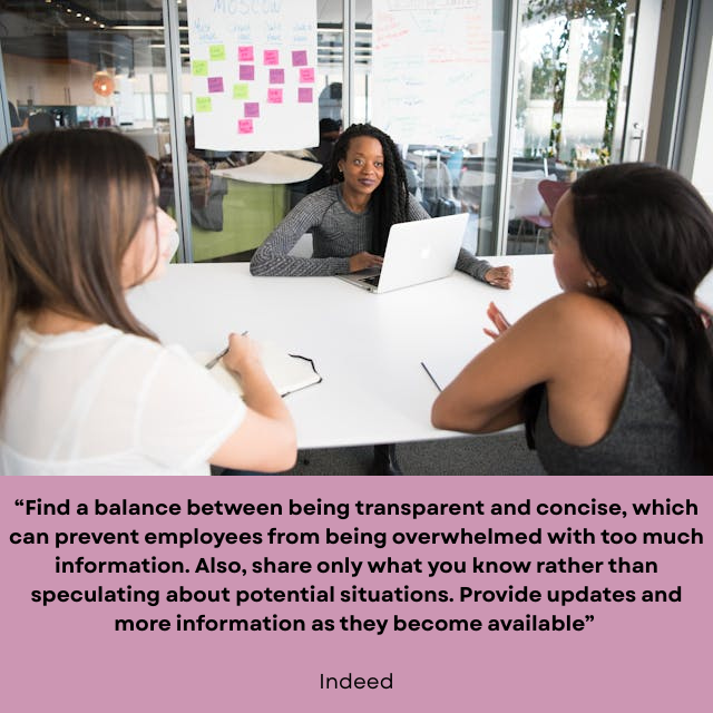 Three women sitting in a conference room talking. Caption reads: “Find a balance between being transparent and concise, which can prevent employees from being overwhelmed with too much information. Also, share only what you know rather than speculating about potential situations. Provide updates and more information as they become available” -Indeed.