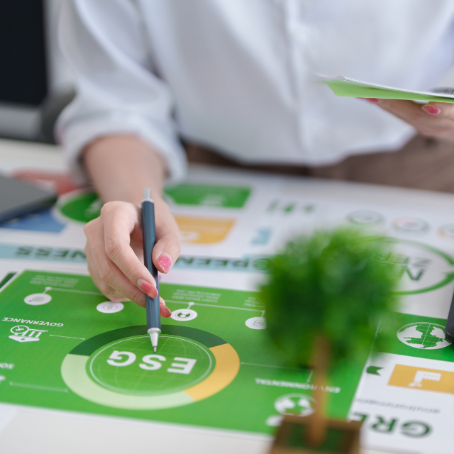 Person wearing button-up shirt working on an ESG plan.