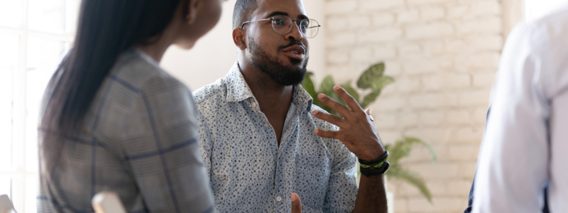 People talking in a meeting.